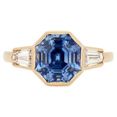 Overall description: Ring Details AGL Report # 1102400 Octagon-Shaped Blue Sapphire weighing .. Step Cut Profile Diamonds weighing 0.14 carats Total Gem Weight: 4.21 Ring Size: 5.5 Measurements: Length: 24.1 mm Weight: 4.8 g Gia Certified Octagon Sapphire Ring, Luxury Style, Gia Certified Octagon Sapphire Luxury Ring, Luxury Gia Certified Octagon Sapphire Ring, Octagon Brilliant Cut Sapphire Ring With Diamond, Gia Certified Sapphire Octagon Ring, Luxury Octagon Brilliant Cut Sapphire Ring, Luxury Octagon Sapphire Ring With Brilliant Cut, Luxury Octagon Sapphire Ring With Center Stone, Octagon Sapphire Ring Fine Jewelry