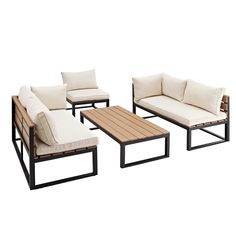 an outdoor furniture set with white cushions and wooden tables on the side, including a coffee table