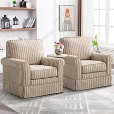 a living room with two chairs and a coffee table