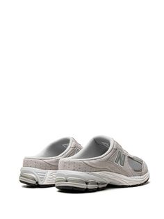 New Balance 2002R Mule "Grey" Sneakers - Farfetch Sporty Gray Slip-on Sneakers, Functional Gray Slip-on Sneakers With Round Toe, Gray Functional Slip-on Sneakers With Round Toe, Gray Slip-on Sneakers For Running, Gray Slip-on Sneakers With Round Toe, Sporty Slip-on Sneakers With Vibram Sole, Slip-on Running Shoes With Cushioned Footbed For Streetwear, Gray Slip-on Sneakers With Round Toe For Streetwear, New Balance Casual Running Shoes With Vented Sides