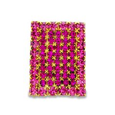 a pink and gold square brooch with flowers on the front, surrounded by small yellow stars