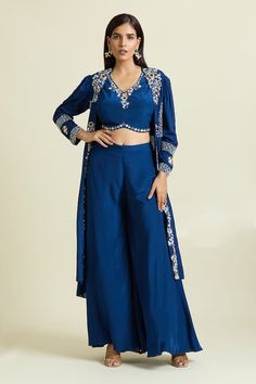 Blue jacket with crystal embellished, resham and dabka floral blossom motifs. Paired with padded embroidered blouse and palazzo. - Aza Fashions Blue Embroidered Long Sleeve Palazzo Set, Blue Long Sleeve Choli With Dupatta, Blue Long Sleeve Choli For Festive Occasions, Festive Blue Long Sleeve Choli, Festive Long Sleeve Blue Choli, Blue Bollywood Long Sleeve Choli, Blue Bollywood Choli With Long Sleeves, Blue Long Sleeve Bollywood Choli, Blue Embroidered Long Sleeve Lehenga