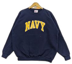 Blue Varsity Sweater For Streetwear, Navy Crew Neck Sweatshirt For Streetwear, Navy Letter Print Sweater For Winter, Navy Collegiate Crew Neck Sweatshirt, Navy Crew Neck Sweatshirt For College, Navy Crew Neck Sweatshirt With Logo, Navy Crew Neck Sweatshirt With Logo Print, Navy Varsity Sweatshirt For Streetwear, Navy Crew Neck Sweater With Letter Print