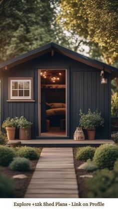 a small shed with the door open and lights on