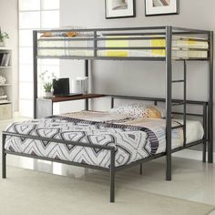 a metal bunk bed sitting in a bedroom next to a desk and bookcase with pictures on the wall