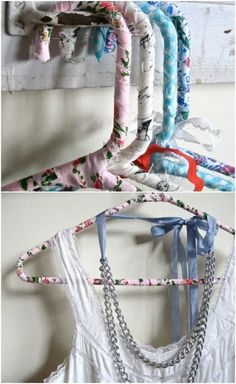 several different types of clothing hangers on a wall with chains attached to the clothes