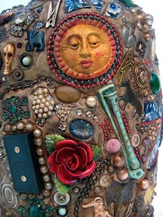 a close up of a sculpture made out of buttons and other items