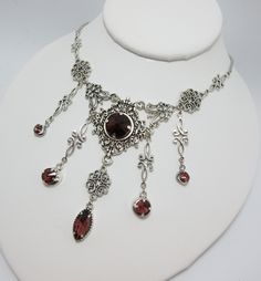 "This is a new handmade necklace. It is made with antiqued silver plated filigrees, accented with high quality AMETHYST PURPLE glass jewels/rhinestones that sparkle like crystals. Decorated portion is 6 1/2\" wide and 3 1/4\" tall in the center. Necklace is adjustable 15-18\" with a lobster clasp and chain extender. If you would like a different length, please send us a message. Matching earrings and headpiece are listed in our store." Silver Necklaces With Historical Design For Wedding, Gothic Metal Jewelry With Filigree, Gothic Filigree Metal Jewelry, Antique Silver Necklace With Historical Design, Gothic Sterling Silver Jewelry With Intricate Design, Ornate Decorative Necklaces For Wedding, Antique Silver Victorian Metal Necklace, Victorian Antique Silver Necklace, Victorian Antique Silver Metal Necklace