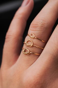 This ring is really cute and easy to wear! The twisted open knot adds a bit of extra detail to any stack. This is one single length of metal that I've knotted into a pretzel-like knot and soldered around the back. This listing is for ONE SINGLE RING. Each ring is made from 14K GOLD FILL. Shown stacked with our other minimalist knot rings and extra thick ring! Every piece is organic and unique — no two Hannah Naomi pieces are exactly alike.Hand-crafted to order in our Portland, OR studio. Knot Rings, Cute Promise Rings, Trend Jewelry, Thick Ring, Single Ring, Luxe Jewelry, Gold Ring Designs, Knot Ring, Huggie Hoop Earrings