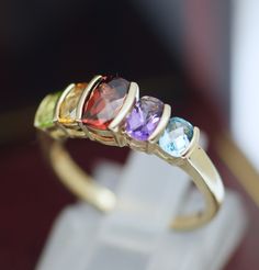 Absolutely Stunning Hand Made Ring. Made in Solid 9K Yellow Gold Set With Multicolour gemstone Metal: 9k Solid Yellow Gold (Marked, and Professionally Tested,Cleaned and Polished ) Stamped;375J.P24 Total Weight;2.37Gram Condition:Pre-Owned The ring in Excellent Condition (any dark marks on the gold in the photos are only reflections) Ring Come with New Luxury Box (different as in the photo). Heirloom Multi-stone Yellow Gold Gemstones, Yellow Gold Multi-stone Jewelry For Anniversary, Anniversary Multi-stone Yellow Gold Jewelry, Classic Multi-stone Yellow Gold Gemstones, Classic Yellow Gold Multi-stone Gemstones, Oval Multicolor Gemstones For Anniversary, Multicolor Oval Gemstones For Anniversary, Hallmarked Multicolor 14k Gold Rings, Multicolor Hallmarked Fine Jewelry Rings