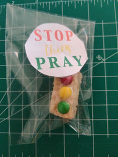 a piece of food in a plastic bag with the words stop think pray on it