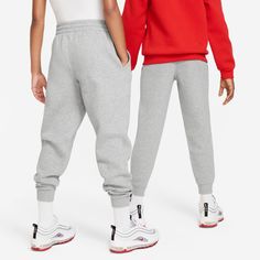 Prepared to tackle all their activities, soft enough for day-long wear, and designed with the style and quality synonymous with the Nike brand—parents and kids alike are guaranteed comfort with Nike's Club Fleece joggers for youth. Angled pockets. Ribbed cuffs. Embroidered Futura logo. Machine wash.