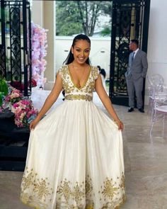 Beautiful Habesha Kemis Handwoven Habesha Dress Ethiopian Traditional Dress Modern Habesha Libs Eritrean Dress ሀበሻ ቀሚስ ሀበሻ ልብስ Luxury Habesha Kemis With Traditional Patterns For Ceremonial Occasions, Floor-length Cotton Dress For Eid, Elegant Cotton Dress For Festivals, Cotton V-neck Dress With Resham Embroidery, Gold Bohemian Dress With Resham Embroidery, Traditional Gold Maxi Dress, Traditional Sleeveless Maxi Dress For Festivals, Traditional V-neck Dress With Intricate Embroidery, Traditional Cotton V-neck Dress