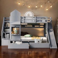 a bunk bed with stairs and lights above it