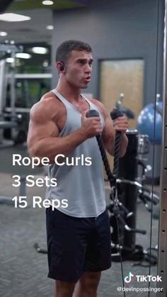 a man holding a rope while standing in front of a gym machine with the words rope curls 3 sets 15 reps