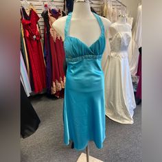 Beautiful Satin Gown In Turquoise Made By Bora. It Is A Halter Style With The Rhinestones And Beading On The Bodice And Halter Straps. Rouched Chiffon Criss Crossed Neckline. Very Elegant, Cute, And Sassy. This Is Nwt. Turquoise Fitted Prom Dress, Elegant Fitted Turquoise Gown, Elegant Fitted Turquoise Evening Dress, Halter Neck Dress With Embellished Fitted Bodice, Fitted Turquoise Evening Dress For Wedding, Turquoise Fitted Evening Dress For Wedding, Elegant Turquoise Prom Dress, Blue Halter Neck Dress For Prom Season, Elegant Turquoise Dress With Fitted Bodice