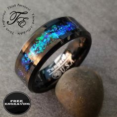 Personalized Men's Promise Ring - Galaxy Opal - Engraved Men's Tungsten Promise Ring This comfort fit band can be used as a men's wedding band or as a promise ring for him. This guy's promise ring is a black beveled edge comfort band that measures 8mm across.   The outer band features blue and green crushed opal creating that shifting galaxy sparkle. You can use any script that can be used in Microsoft word. Please check out photo 2 for a quick list of scripts. If you do not choose a script, Bat Tungsten Engagement Rings, Promise Ring For Him, Blue Tungsten Ring, Opal Promise Ring, Rose Gold Tungsten Ring, A Promise Ring, Promise Rings For Him, Promise Band, Green Galaxy