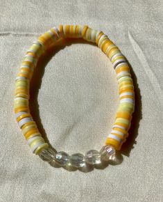 Cute yellow and white beaded bracelet. These are high quality handmade bracelets. They are made with an elastic string so will fit lots of sizes. They are around 6.75 inches. Please note that each braclet will have a very similar beading pattern but not exactly identical. Yellow Beaded Bracelets With Colorful Round Beads, Yellow Bracelets With Colorful Beads, Yellow Bracelets With Colorful Round Beads, Yellow Beaded Bracelets With Spacer Beads, Casual Yellow Beaded Bracelets With 8mm Beads, Yellow Beaded Stretch Bracelet With Round Beads, Casual Yellow Beaded Bracelet With 8mm Beads, Yellow Beaded Stretch Bracelet, Casual Yellow Beads For Beach