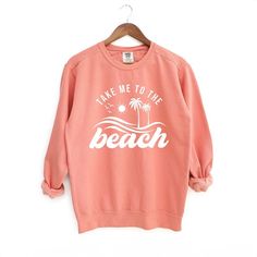 Looking for a cute versatile top to wear? Make sure to grab one of our Graphic Sweatshirts! This soft and comfortable shirt is the perfect top for any outfit. It can be paired with biker shorts, Jeans, or the classic stay at home sweats! This sweatshirt is true-to-size, so be sure to order your regular size! If you are looking for a more oversized look, make sure to size up. Soft-washed Crew Neck Top For Vacation, Spring Beach Cotton Sweatshirt, Comfortable Cotton Beach Season Tops, Long Sleeve Soft-washed Summer Sweatshirt, Soft-washed Long Sleeve Summer Sweatshirt, Soft-washed Long Sleeve Sweatshirt For Summer, Casual Cotton Summer Sweatshirt, Casual Cotton Sweatshirt For Summer, Summer Beach Cotton Sweatshirt