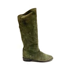 Vintage 1970s women's khaki green suede knee high German style traditional boots by Sudtiroler Trachtenshuhe. Features khaki green suede uppers, rounded toe, knee high rise, pull on style, and barely there block heel. Excellent vintage condition. Made in Italy.   Heel to toe (inside shoe): 9.75 inches  Ball of foot (bottom of sole): 3.5 inches  Heel height: 1 inch  Shaft height: 15 inches  Circumference: 14.5 inches  Size 7.5/8 (refer to measurements for best fit) 1970s Women, German Style, Inside Shoes, Womens Khakis, Womens Knee High Boots, Green Suede, 5 Inch Heels, Khaki Green, Vintage 1970s