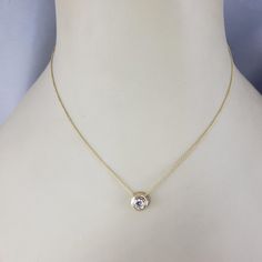 14 Karat Yellow Gold Diamond Solitaire Necklace-  This sparkling solitaire necklace features one round brilliant cut diamond set in classic 14K yellow gold.  Approximate total diamond weight:  .42 ct. - .50 ct.  Diamond clarity:  VS  Diamond color: G  Stamped: 14K  Size:  16 inches (necklace)            8 mm (pendant)  Weight:  1.7 dwt. / 8.2 gr.  *Stone weights are approximated and calculated by formula.  Very good condition, professionally polished.  Will come packaged in a gift box or pouch (when possible) and will be shipped U.S. Priority Mail Insured. Classic 14k Yellow Gold Solitaire Necklace, Solitaire Necklace With Round Pendant For Formal Occasions, Formal Solitaire Necklace With Single Cut Diamond Pendant, Formal Necklace With Single Round Diamond, Formal Solitaire Necklace With Single Cut Diamonds, Elegant Gold Birthstone Necklace With Bezel Setting, Gold Solitaire Necklace With Brilliant Cut For Formal Occasions, Gold Solitaire Necklace For Formal Events, Gold Solitaire Necklace With Round Stone For Formal Occasions