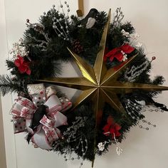 a christmas wreath is hanging on the door