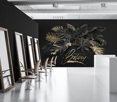 an empty salon with chairs and mirrors on the wall next to it is a palm tree mural