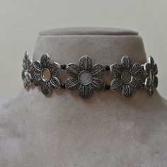 Beautiful Floral Oxidized Silver Choker Necklace | Gift For Women "Adorn yourself with the timeless elegance of our " Beautiful Floral Elegance Oxidized Silver Choker Necklace." Crafted with meticulous attention to detail, this exquisite piece features a captivating floral design that exudes grace and sophistication. Each delicate petal and intricate detail of the floral motif is brought to life through the oxidized silver finish, adding depth and dimension to the necklace. The choker style adds a modern touch to the classic floral design, making it a versatile accessory that can be worn for any occasion. This necklace is more than just a piece of jewelry--it's a symbol of beauty, femininity, and elegance. Whether worn as a statement piece or layered with other necklaces, it is sure to dra Adjustable Silver Alloy Choker, Adjustable Metal Choker, Adjustable Vintage Metal Choker, Vintage Metal Choker Nickel-free, Nickel-free Vintage Metal Choker, Vintage Nickel-free Metal Choker, Vintage Metal Nickel-free Choker, Vintage Round Adjustable Choker, Vintage Adjustable Round Choker