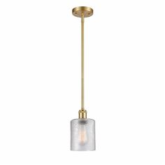 a light fixture with a glass shade on the bottom and a gold metal rod in the middle