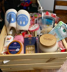 a wooden box filled with personal care products and toiletries on top of a table