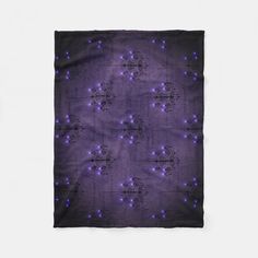 a purple and black square scarf with stars on it