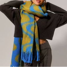 a woman wearing a blue and yellow scarf