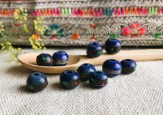 A set of 10 ethnic Yak horn beads (tinted blue) coming directly from Nepal. These are made entirely by hand and are inlaid with Turquoise and brass wire. They are very original. In Nepal they are often used for making necklaces or bracelets. They will be used for all types of creations. Sold by: Lot of 10 pearls Size available: 8mm or 10mm Shipping will be careful and fast! Visit the Nepalmashop.fr store for more choices in ethnic beads and jewelry! Namaste! Blue Wooden Beads For Festival, Artisan Blue Wooden Beads, Blue Wooden Beads For Jewelry Making, Traditional Blue Jewelry With Wooden Beads, Traditional Blue Wooden Beads, Blue Bohemian Beads For Festive Occasion, Bohemian Blue Beads For Festive Occasions, Traditional Large Blue Beads, Artisan Blue Polished Beads