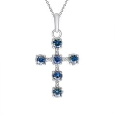 Genuine Blue Sapphire and Diamond Studded Cross Pendant Necklace in Solid GoldThis cross pendant necklace has a simple design that is elevated with blue sapphires and diamond stones, making it the perfect everyday necklace to add a pop of color to your looks.Stones Information: Stone: Sapphire, Cubic ZirconiaSize and No. of Sapphires: 3mm, 6Size and No. of CZ: 1mm, 10Product Information:Metal: 10K Gold, 14K GoldWeight: 1.26 g.Approx. Dimensions: 32 mm. x 19 mm.SKU: TM1847Made in Los Angeles, CA Blue Gemstone Cross-shaped Jewelry, Blue Sterling Silver Crucifix Jewelry, Blue Sterling Silver Cross Pendant Necklace, Blue Cross Jewelry For Anniversary, Elegant Blue Cross Pendant Jewelry, Blue Cross Pendant Necklace For Anniversary, Everyday Necklace, Cross Pendant Necklace, Gold Pendant Necklace