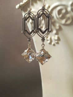 These Art Deco style vintage glass dangles are the perfect earrings for a Great Gatsby themed wedding. They were inspired by the dazzling diamond Art Deco Clip-on Jewelry For Formal Occasions, Art Deco Clip-on Earrings For Formal Occasions, Art Deco Formal Clip-on Earrings, Formal Art Deco Clip-on Jewelry, Clip-on Art Deco Jewelry For Formal Occasions, Victorian Silver Bridal Earrings For Formal Events, Victorian Silver Bridal Earrings For Formal Occasions, Elegant Vintage Charm Jewelry For Anniversary, Classic Metal Clip-on Earrings For Wedding