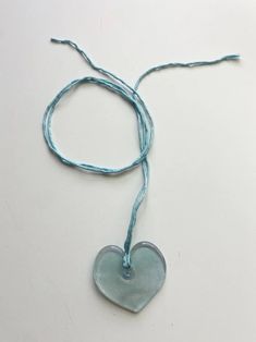 Handmade blue glass heart on hand sewn silk cord. Hearts measures approx. 2” across. Shape may vary slightly. Silk Cord Jewelry, Brooke Callahan, Blue Heart Necklace, Indie Craft, Red Choker, Tube Necklace, Rainbow Necklace, Daisy Earrings, Silk Cord