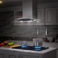 a stove top oven sitting inside of a kitchen next to a counter with fruit on it