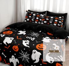 a bed with halloween themed sheets and pillows