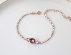 Our delicate rose gold bridal bracelet can be customized with your wedding colors. - Handmade to order with CRYSTALLIZED™ - Swarovski Elements - Swarovski blush rose, vintage rose and clear stones - Rose gold plated brass - Available in other finishes and Swarovski crystals upon request - 7 inches long and extends to 8 inches. - Each piece is gift wrapped matching pieces: https://www.etsy.com/listing/644577345/dainty-bridal-jewelry-set-bridesmaid?ref=shop_home_active_4&frs=1 Please see Swaro Delicate Pink Bracelets For Wedding, Delicate Pink Bracelet For Wedding, Rose Gold Crystal Bracelet For Wedding, Elegant Pink Gold Bracelets For Wedding, Dainty Rose Gold Bracelets For Wedding, Elegant Pink Gold Wedding Bracelets, Adjustable Pink Gold Wedding Bracelets, Adjustable Pink Gold Wedding Bracelet, Delicate Rose Gold Bracelets For Bridesmaids