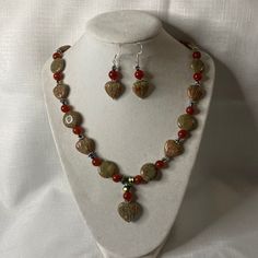 This Handmade Set Features Natural Unakite In Round And Ribbed Heart Shapes. Also Made With Round Natural Carnelian, And Crystals! The Colors On This Set Are Neutral Greens, Taupes And Terra Cotta. It’s Finished With A Pewter Toggle Clasp On The Necklace And Silver Hook Backs On The Earrings. It Measures About 22” Long. Libra Pendant, Pearl Clasp, Elephant Pendant Necklace, Green Beaded Necklace, Constellation Necklace, Horn Pendant, Seashell Necklace, Gold Charm Necklace, Elephant Pendant