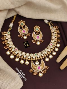 Description :- Amrapali Necklace, Moissanite Polki Necklace Set, Yellow Necklace, Mint Green Necklace, Party Wear, Festive Wear, Designer Necklace, Wedding Gift yourself a royal look with this perfectly crafted kundan necklace set from Manalisstudio. Crafted with high quality kundan stones and pearls, it is impressive in design. The green enamel artwork adds perfect texture to the design. Perfect for weddings and festivities, this antique necklace set should be put on with your favorite sari or Temple Jewelry Style Necklace With Tilla For Anniversary, Cutdana Necklaces For Receptions, Kundan Necklace With Tilla For Anniversary And Festivals, Bollywood Style Round Necklaces For Reception, Round Bridal Necklace For Diwali Reception, Festivals Bridal Necklace With Intricate Design For Anniversary, Diwali Reception Bridal Necklace, Diwali Reception Necklace With Tilla Detailing, Temple Jewelry Bridal Necklace With Stone Work For Anniversary