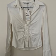 Size S Zara White Ruched Blouse/ Button Down. Brand New Condition. Nice And Fitted On. White Ruched Blouse For Fall, Spring Button-up Ruched Top, Spring Ruched Button-up Top, Fitted Ruched Button-up Blouse, Chic Ruched Button-up Top, Ruched Long Sleeve Blouse For Day Out, Long Sleeve Ruched Blouse For Day Out, Elegant Ruched Zara Top, Zara Fitted Shirt With Buttons