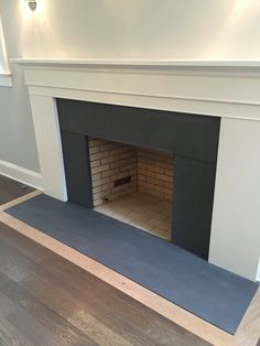 an empty room with a fireplace in it