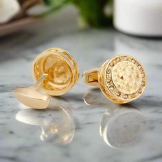 These circular gold cufflinks, adorned with striking blue stones, are the epitome of luxury and sophistication. The combination of gold and blue offers a timeless elegance, making these cufflinks a perfect accessory for special occasions. Dress Shirts: Crisp white dress shirt – provides a classic canvas that highlights the gold and blue contrast. Light blue dress shirt – complements the blue stones while adding a cohesive look. Pale yellow dress shirt with a subtle grid pattern – enhances the go Classic Metal Jewelry For Business, Round Screw Back Cufflinks For Business, Elegant Clip-on Cufflinks For Business, Elegant Formal Clip-on Cufflinks, Luxury Screw-back Cufflinks For Wedding, Luxury Screw Back Cufflinks For Wedding, Luxury Wedding Cufflinks With Screw Back, Timeless Gold Cufflinks For Business, Luxury Gold Cufflinks For Business