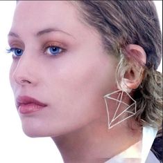 These geometrical earrings are made of multiple triangles to form a large diamond shape design.  You will be surprised how lightweight they are. Eye-catching and elegant to wear.  They add something extra to any outfit, while still keeping it simple and stylish. Length - 6.5 cm Width - 4,5 cm There is a gold plated version for those who prefer them in gold. Chic Geometric Earrings For Party, Silver Triangle Earrings For Party, Triangle Silver Jewelry For Party, Silver Triangle Party Earrings, Modern Geometric Earrings For Party, Trendy Geometric Earrings For Party, Modern Triangle Earrings For Party, Modern Geometric Party Earrings, Modern Triangle Party Earrings