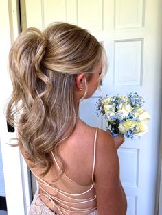 a half up half down prom hair inspiration. This style is super easy- after your hair is in curls use an elastic to create a half up pony tail, hold the pony tail up towards the crown of your head and then secure a bobby pin in underneath. after this tease the pony tail hiding the elastic/bobby pin and give an illusion of a voluminous half up pony. Pony Wedding Guest Hair, Hair Inspiration For Wedding Guest, Half Up Half Down Hair Braided Bun, Cute Half Up Half Down Hoco Hair, Bridal Shower Half Up Half Down, Homecoming Hair For Open Back Dress, Hoco Hair Inspo Ponytail, Half Pony Bridesmaid Hair, Hoco Hair Ideas Half Up Half Down