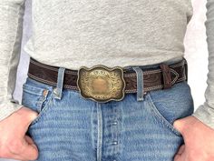 "BUCKLE - Handmade western style cowboy buckle made. Add your own personalization to customize your belt! LENGTH - 1-1/2\" Wide (38 millimeters wide) Elevate your men's western fashion with our exceptional Handmade Genuine Leather Western Belt. Crafted by our experts, this Cowboy Style belt is more than a simple accessory designed for the cowboy at heart. It's a rugged, one-of-a-kind statement piece needed in your wardrobe. SIZE - For the best fit, pick your belt at 2\" longer than your waist size. (For example, if you wear a size 34 pants, you should order a size 36 belt) 100% MONEY BACK GUARANTEE - Make a statement with our Traditional Cowboy Belt--shop with full comfort and security of our Money Back Guarantee system now and experience the perfect fusion of Genuine Leather, Cowboy Style Western Concho Belt Buckles For Western-themed Events, Western Adjustable Belt Buckles For Rodeo, Western Style Adjustable Belt Buckles For Rodeo, Western Concho Belts For Ranch, Classic Concho Belt For Western-themed Events, Adjustable Western Concho Belt Buckles, Western Hand Tooled Belt Buckles For Rodeo, Western Concho Belt Buckles For Country Events, Adjustable Concho Belt Buckles For Western-themed Events