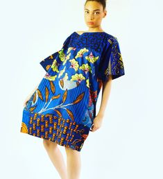 African print blue mix tunic dress  - Carla oversized short casual summer Ankara mix style If you are looking for an oversized tunic style dress with and African flare, this is it. This limited edition creation will dazzle you and fit your body perfectly.  Enjoy the attention to detail and the mix of African prints that we have combined, to make this dress absolutely stunning. In addition to this stunning mix of African Prints is our kimono style loose sleeve will definitely make you the best lo Cotton V-neck Dress With Graphic Print, Blue Printed Knee-length Mini Dress, Patterned Printed Dresses For Daywear, Spring Cotton Dress With Kimono Sleeves, Patterned Short Sleeve Midi Dress For Summer, Summer Patterned Short Sleeve Midi Dress, Summer Patterned Midi Dress With Short Sleeves, Oversized Mini Dress For Summer, Patterned Printed Short Sleeve Dress