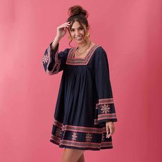 Sometimes you just want to throw on something effortless and casual without skimping on style. Enter the Tess Embroidered Dress! There's two features of this dress that make it the perfect wardrobe piece for conveying effortlessly chic style. The first is the fun yet sophisticated pink embroidery on the square neckline, sleeves and hem that pops against the super soft indigo blue denim. The second is the playful flowy fit that provides comfort while still being feminine and flattering. Sheer per Embroidered Spring Dresses For Day Out, Spring Embroidered Dress For Day Out, Embroidered Dress For Spring Day Out, Chic Embroidered Dresses For Day Out, Embroidered Cotton Dress For Day Out, Embroidered Cotton Mini Dress For Vacation, Casual Embroidered Midi Dress For Day Out, Chic Embroidered Cotton Mini Dress, Chic Cotton Dress With Floral Embroidery