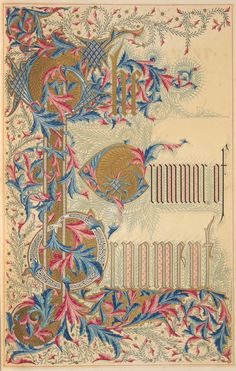 an old book with ornate designs and writing on the front cover, in red, white, and blue